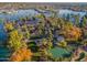 Aerial view of a landscaped island park with gazebos and walking paths at 10632 W Roundelay Cir, Sun City, AZ 85351