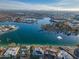 Aerial view of lakefront property with a fountain and surrounding homes at 10632 W Roundelay Cir, Sun City, AZ 85351