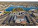 Aerial view of a community center and tennis courts with adjacent parking at 10632 W Roundelay Cir, Sun City, AZ 85351