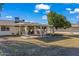 Spacious covered patio with seating area and lush landscaping at 10632 W Roundelay Cir, Sun City, AZ 85351