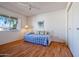 Bedroom with double bed, wood floors, and large closet at 10632 W Roundelay Cir, Sun City, AZ 85351