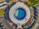 Aerial view of circular pool, deck, and surrounding parking at 10632 W Roundelay Cir, Sun City, AZ 85351