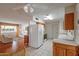 Open kitchen with a view into the living room and dining area at 10632 W Roundelay Cir, Sun City, AZ 85351