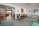 Living room with light green carpet, and comfortable seating at 10632 W Roundelay Cir, Sun City, AZ 85351