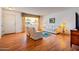 Living room with hardwood floors and a view to the kitchen at 10632 W Roundelay Cir, Sun City, AZ 85351