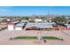 Aerial view showing a single-story home with a detached garage and artificial turf at 11120 E Grove St, Mesa, AZ 85208