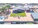 Aerial view showcasing house, detached garage, and spacious yard at 11120 E Grove St, Mesa, AZ 85208