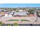 Aerial view of single-story home, detached garage, and landscaped yard at 11120 E Grove St, Mesa, AZ 85208
