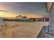 Large backyard with a gravel area and landscape lighting at 11120 E Grove St, Mesa, AZ 85208