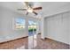 Bedroom with tile floors, ceiling fan and backyard access at 11120 E Grove St, Mesa, AZ 85208