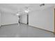 Large bedroom with tiled floors and ceiling fan at 11120 E Grove St, Mesa, AZ 85208