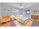Light and airy bedroom with tiled floors at 11120 E Grove St, Mesa, AZ 85208