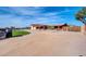 Single-story home with covered porch, attached garage, and landscaped yard at 11120 E Grove St, Mesa, AZ 85208