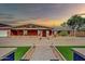 Front view of single-story home with a walkway and landscaping at 11120 E Grove St, Mesa, AZ 85208