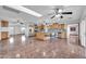 Open concept kitchen with island and dining area at 11120 E Grove St, Mesa, AZ 85208