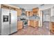 Kitchen features stainless steel appliances and wood cabinets at 11120 E Grove St, Mesa, AZ 85208