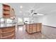 Open kitchen with granite counters and large island at 11120 E Grove St, Mesa, AZ 85208
