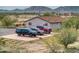 Home's exterior with parking area and desert landscape at 11865 N Allegro Rd, Maricopa, AZ 85139