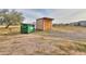 Image shows a storage shed and dumpster at 11865 N Allegro Rd, Maricopa, AZ 85139