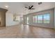 Bright living room with tile floors and sliding glass doors leading to a patio at 13578 W Cypress St, Goodyear, AZ 85395