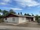 Long, ranch style home with a red roof and mature landscaping at 1437 E Hall St, Tempe, AZ 85281