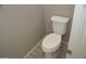 Small half bathroom with toilet and wood-look tile floor at 1543 N Balboa --, Mesa, AZ 85205