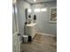 Clean bathroom with a vanity, mirror, and window for natural light at 16210 N 32Nd Way, Phoenix, AZ 85032