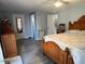 Bright bedroom with wood-look flooring and large bed at 16210 N 32Nd Way, Phoenix, AZ 85032