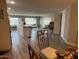Open concept dining area with glass-top table and view into living room at 16210 N 32Nd Way, Phoenix, AZ 85032