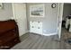 Clean and bright entryway with shoe storage and wood-look flooring at 16210 N 32Nd Way, Phoenix, AZ 85032