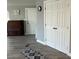 Clean and bright hallway with wood-look flooring and storage at 16210 N 32Nd Way, Phoenix, AZ 85032