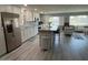 Open concept kitchen featuring granite island and stainless steel appliances at 16210 N 32Nd Way, Phoenix, AZ 85032