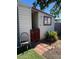 Small side yard with a gate and a rustic chair at 16210 N 32Nd Way, Phoenix, AZ 85032