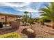 Desert landscaping with a covered patio and grill at 16551 W Wild Horse Way, Surprise, AZ 85387