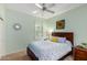 Bright bedroom with a queen-size bed and ceiling fan at 16551 W Wild Horse Way, Surprise, AZ 85387