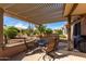 Covered patio with seating area and desert views at 16551 W Wild Horse Way, Surprise, AZ 85387