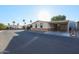 Single-story home with carport and palm trees at 17200 W Bell Rd # 1674, Surprise, AZ 85374