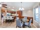 Eat-in kitchen with granite counters and wood cabinets at 17200 W Bell Rd # 1674, Surprise, AZ 85374