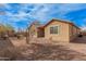 Landscaped backyard with gravel and desert landscaping at 1727 N 213Th Dr, Buckeye, AZ 85396