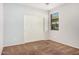 Bedroom with sliding door and window at 1727 N 213Th Dr, Buckeye, AZ 85396