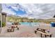 Community pool with picnic tables and mountain views at 1727 N 213Th Dr, Buckeye, AZ 85396