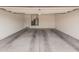 Attached garage with ample space for parking and storage at 1727 N 213Th Dr, Buckeye, AZ 85396