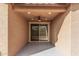 Covered patio with ceiling fan and sliding glass door access at 1727 N 213Th Dr, Buckeye, AZ 85396