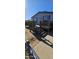 Front view of a manufactured home with a wooden deck and stairs at 18002 N 20Th N Pl, Phoenix, AZ 85022