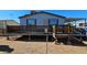 Single-story home with covered porch and wood deck at 18002 N 20Th N Pl, Phoenix, AZ 85022