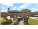 Backyard patio with seating area and fire pit at 18225 W Foothill Dr, Surprise, AZ 85387