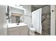 Modern bathroom with a white vanity and walk-in shower at 18225 W Foothill Dr, Surprise, AZ 85387