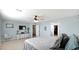Bright bedroom with large bed, ceiling fan and walk-in closet at 18225 W Foothill Dr, Surprise, AZ 85387