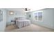 Bedroom with a queen-size bed and ceiling fan at 18225 W Foothill Dr, Surprise, AZ 85387