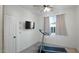 Spacious bedroom with a ceiling fan and window at 18225 W Foothill Dr, Surprise, AZ 85387